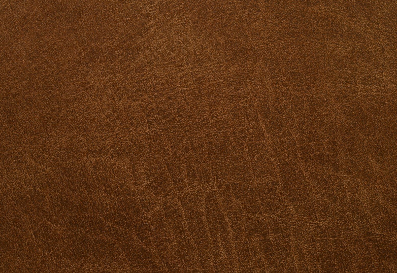 Close-up of veg-tan grain — the only leather whose fibres take and hold a wet-molded shape