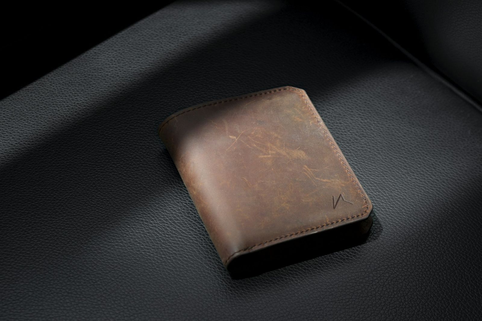 A handmade bifold wallet — a classic project built from two different leather weights